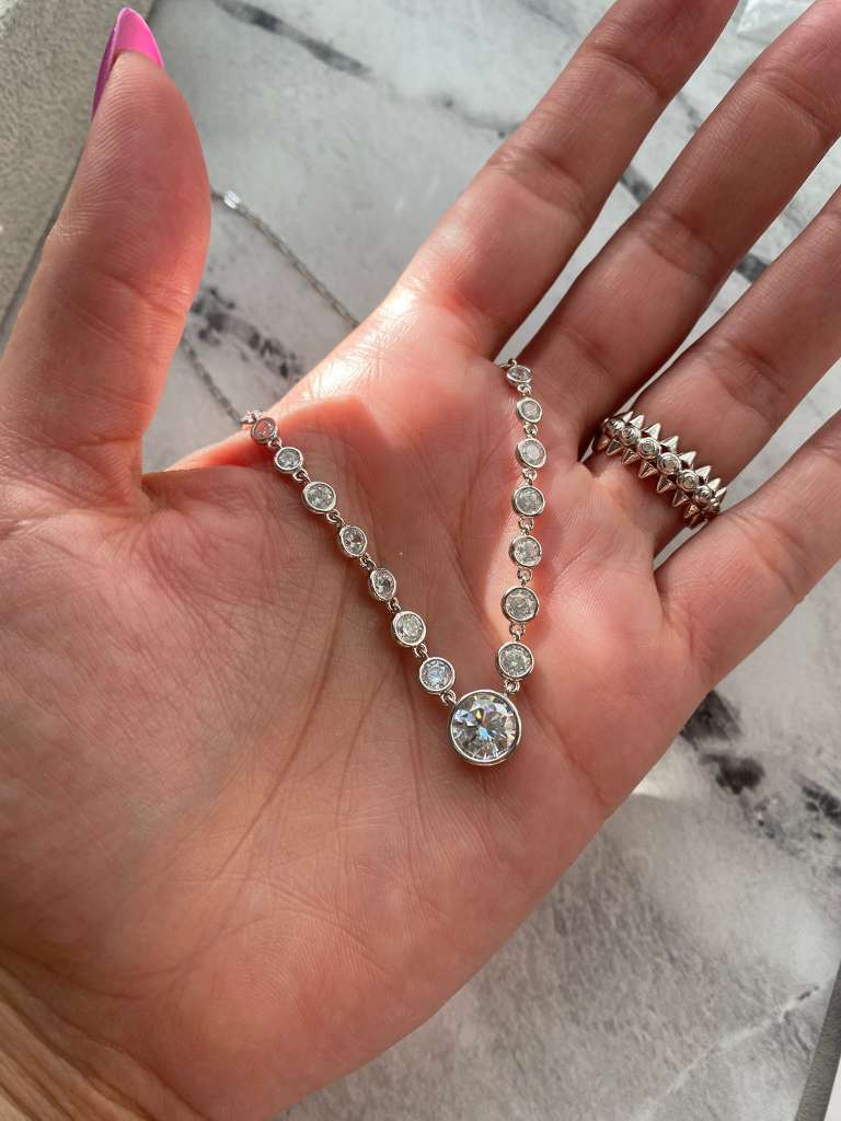 A modern take on timeless sparkle.
This necklace features a delicate bezel-set design with brilliant zirconia stones handcrafted over 925 sterling silver. The round-cut crystals catch the light beautifully, giving an effortless glow that feels refined yet bold.
Length: 16” + 2” extender
Perfect for layering or wearing solo — the kind of sparkle you’ll never want to take off. 
