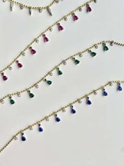 Playful sparkle, timeless charm.
This dainty teardrop necklace features zirconia drops in vibrant colors, delicately set along a beaded 925 sterling silver chain with 18k gold plating.
Its 16” + 2” extender makes it perfect for layering or wearing solo.

Available in multiple shades — clear, sapphire blue, ruby pink, and emerald green — so you can mix, match, and glow in your own way
