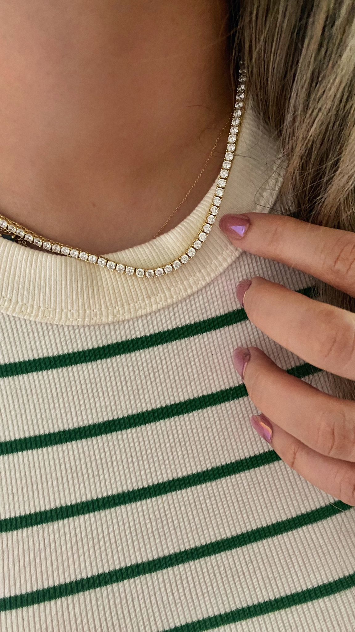 A timeless sparkle that never goes unnoticed.
This tennis necklace is crafted in 925 sterling silver with 18k gold plating, featuring 3mm round-cut zirconia stones that radiate brilliance from every angle.
Designed with a secure figure-8 clasp, it combines sophistication and everyday wearability in a flawless finish.
Length: 16”
Thickness: 3mm
Shine that elevates every look — from casual chic to full glam.